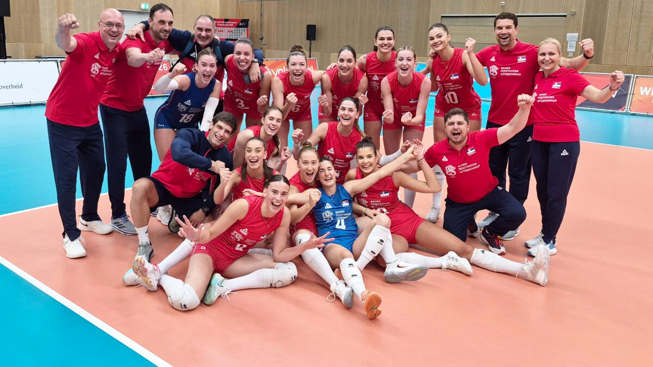 Serbia U22 players at the net during a European volleyball match
