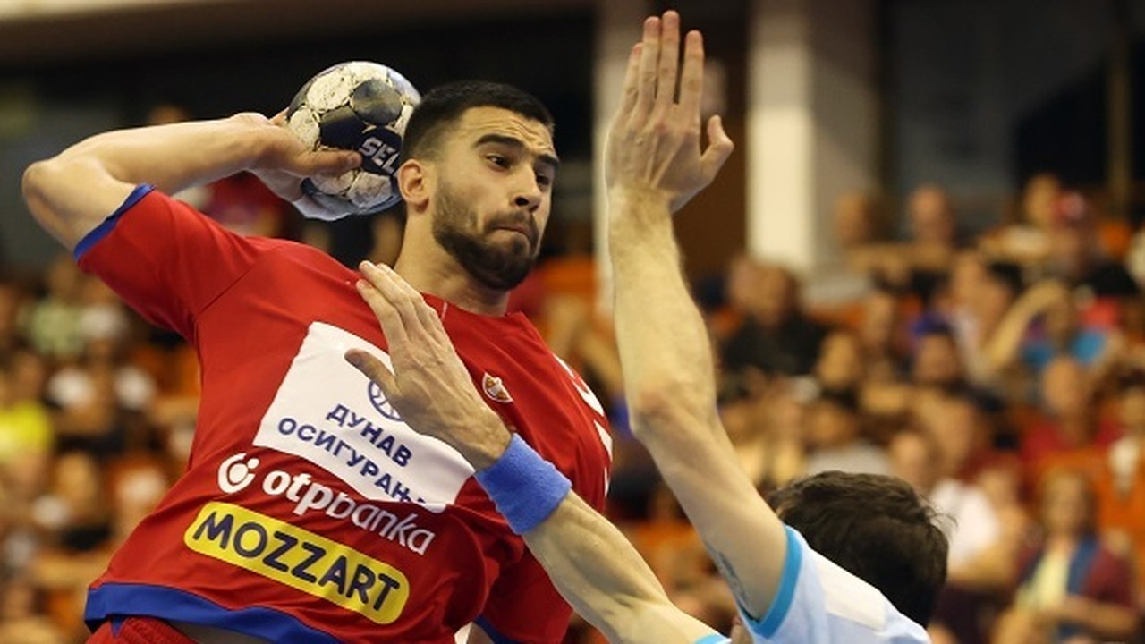 Milos Kos shoots for Serbia during an international handball match