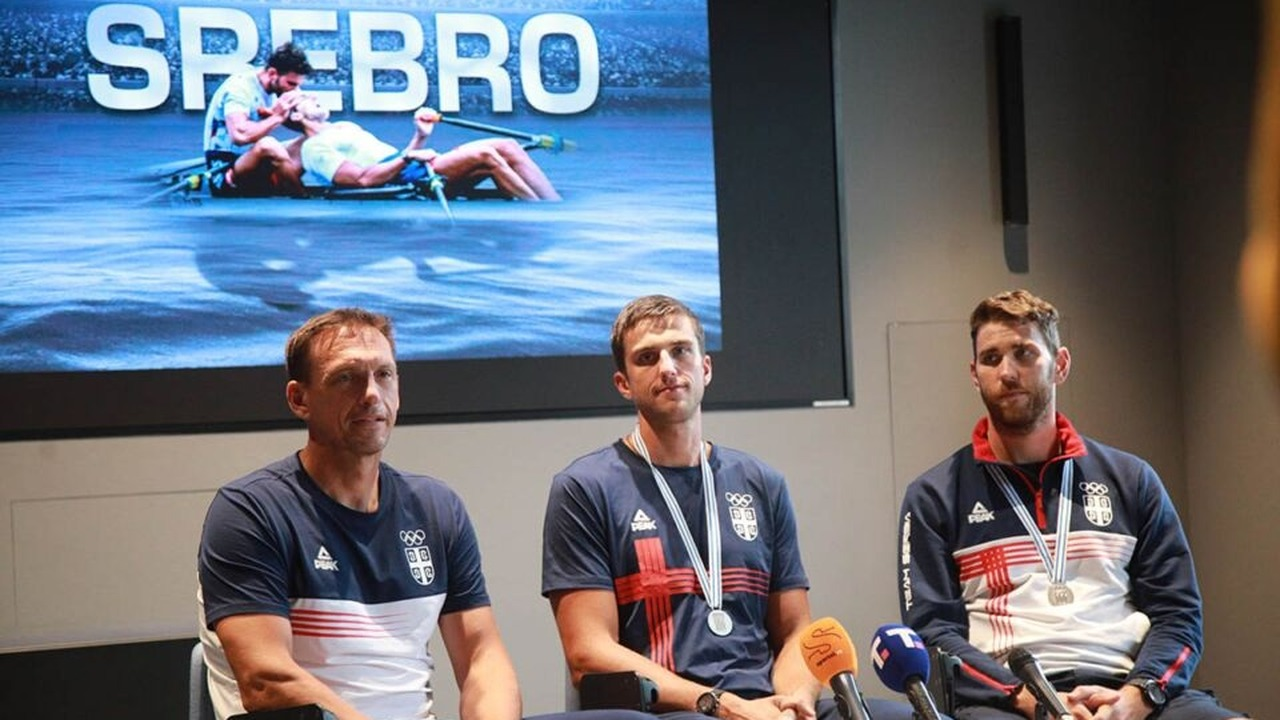 Serbian rowers speak during an interview