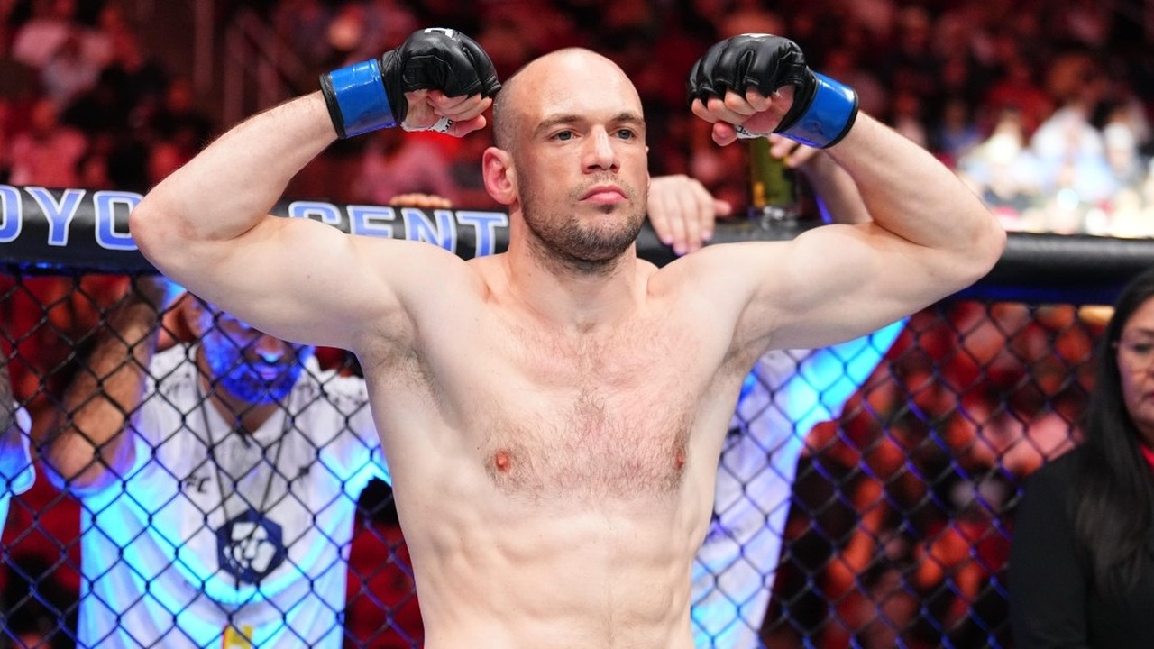 Uroš Medić celebrates inside the UFC cage