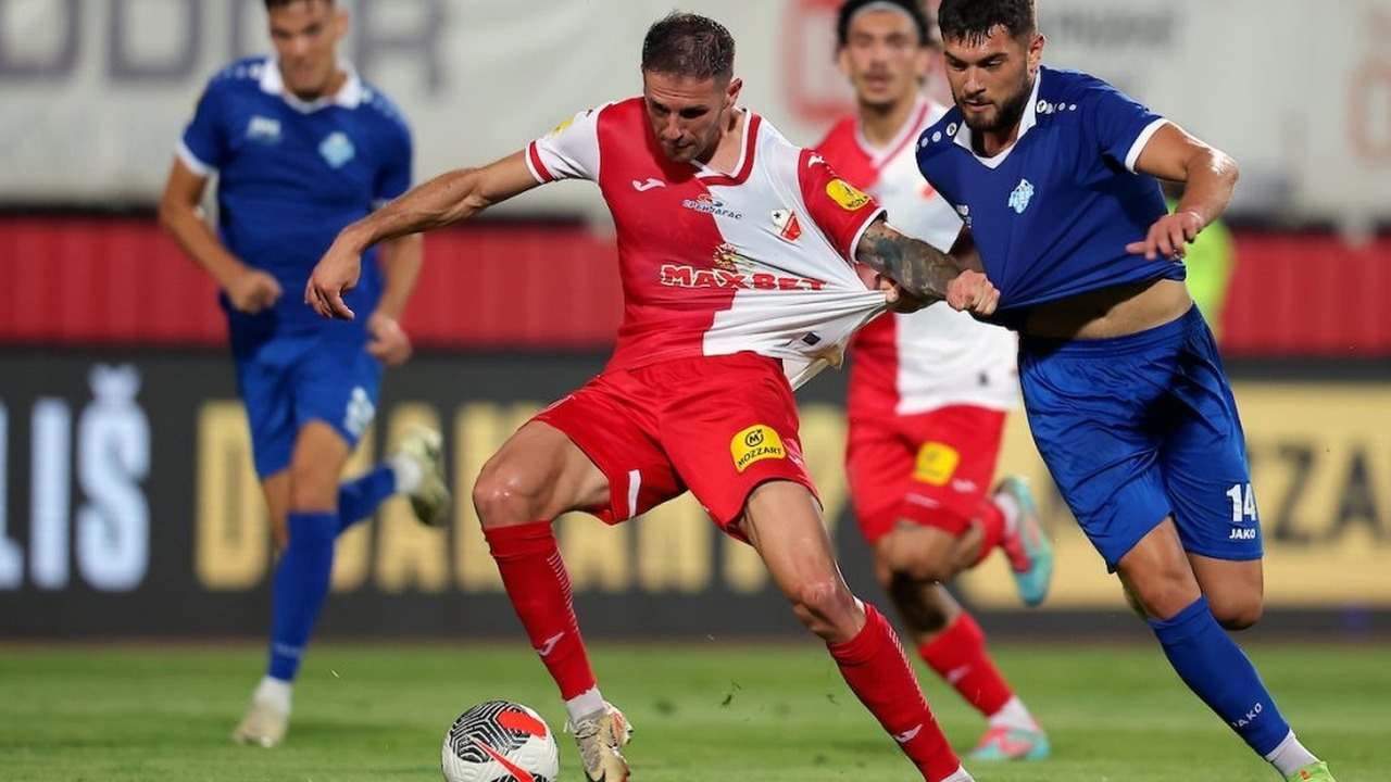 Vojvodina and Radnik players contest the ball during a league match