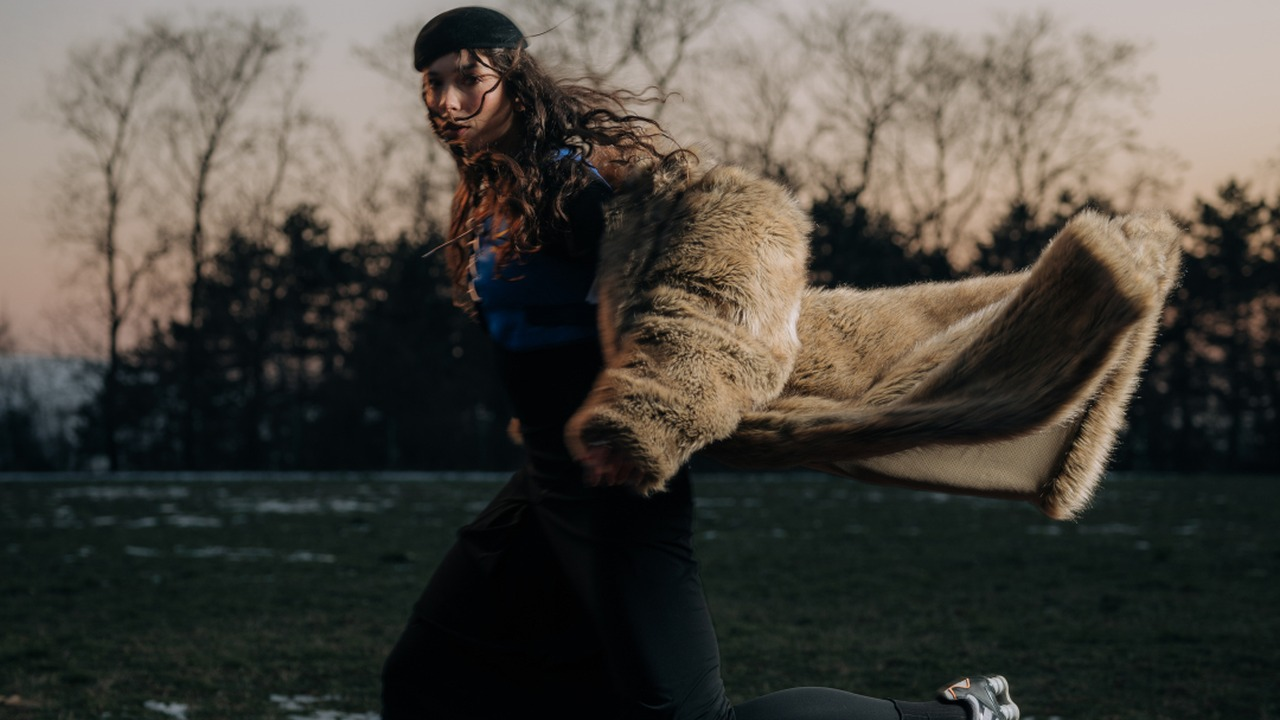 Aleksandra Pesic runs on an outdoor athletics track