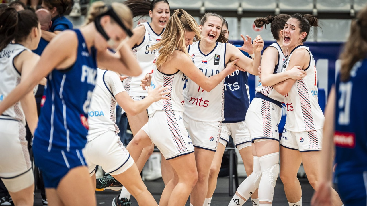 Serbia's under-18 women's basketball players celebrate on court
