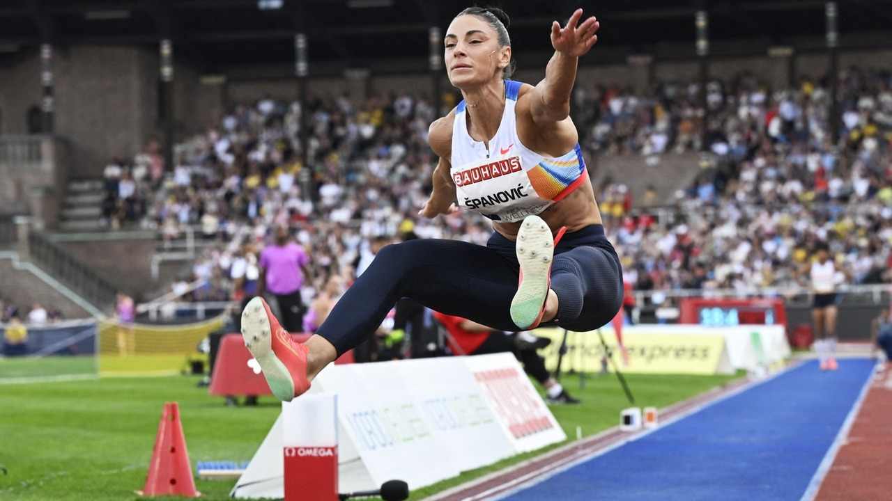 Ivana Španović lands after a triple jump