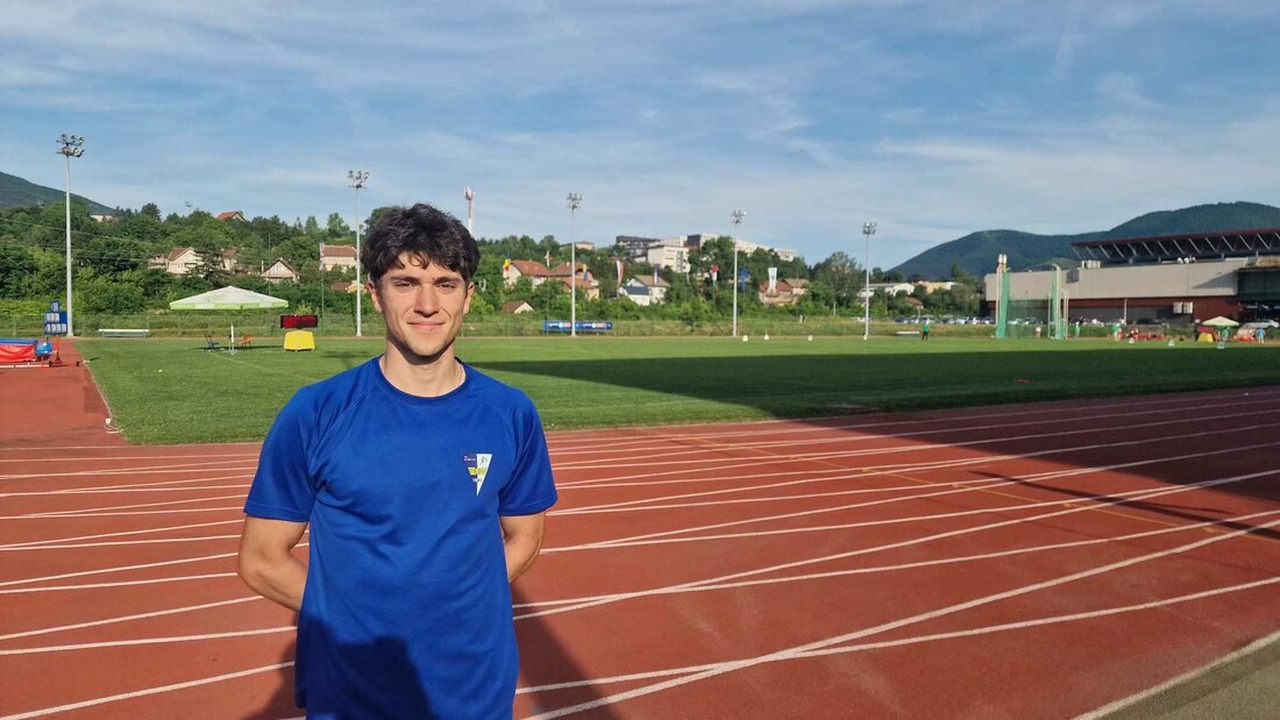 Darijo Basic Palkovic stands beside an athletics track