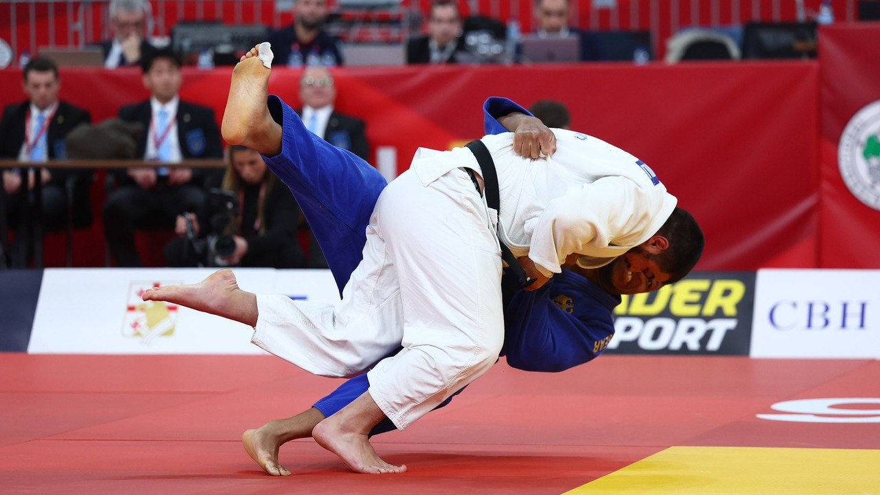 Two heavyweight judokas compete on the tatami