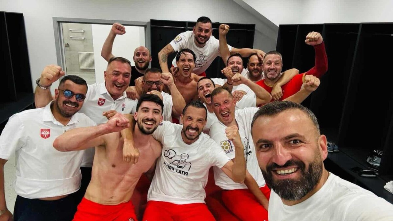 Serbia socca players and staff celebrate in the dressing room