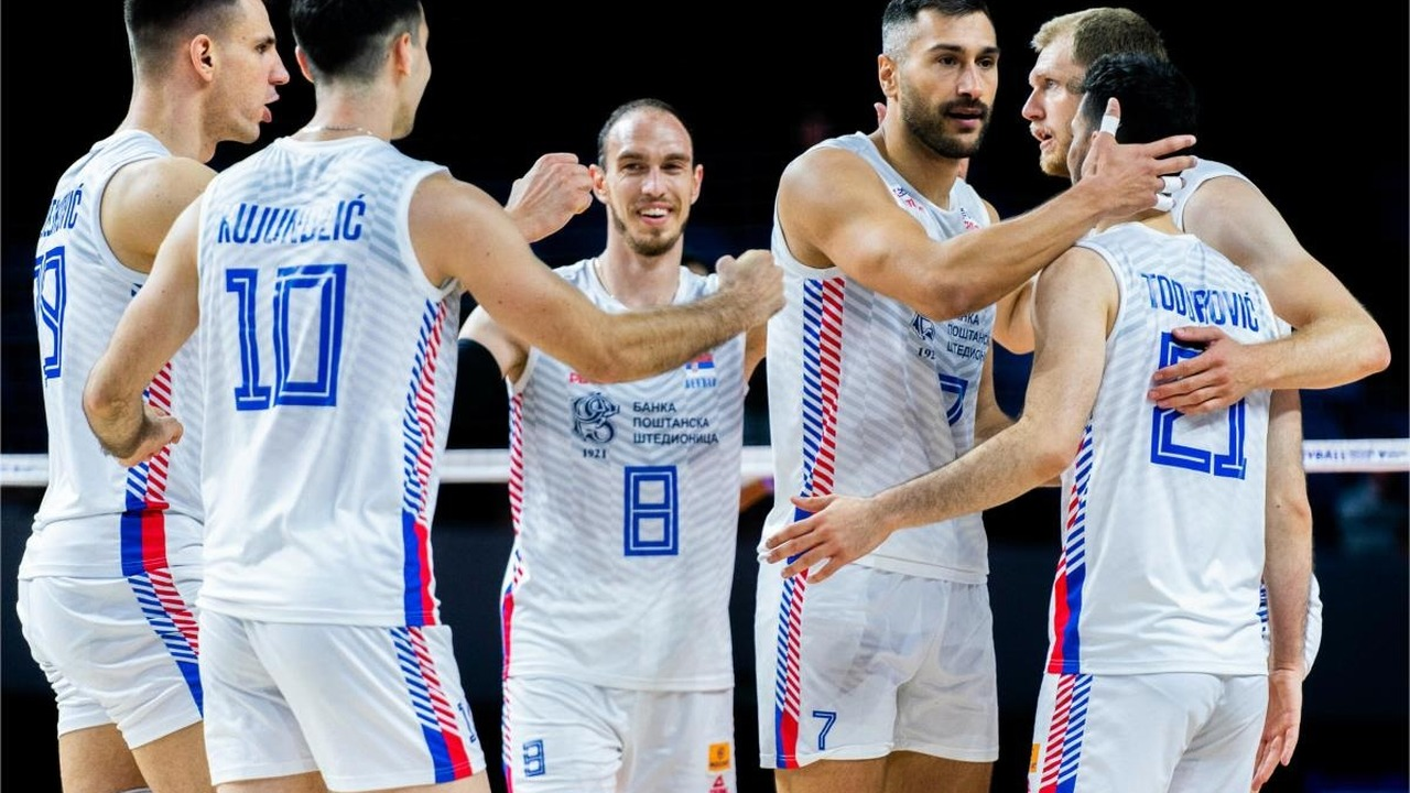 Serbia volleyball players gather together on the court