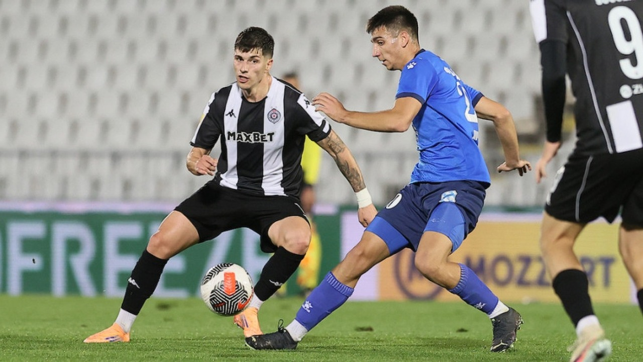 Partizan players compete during a league match
