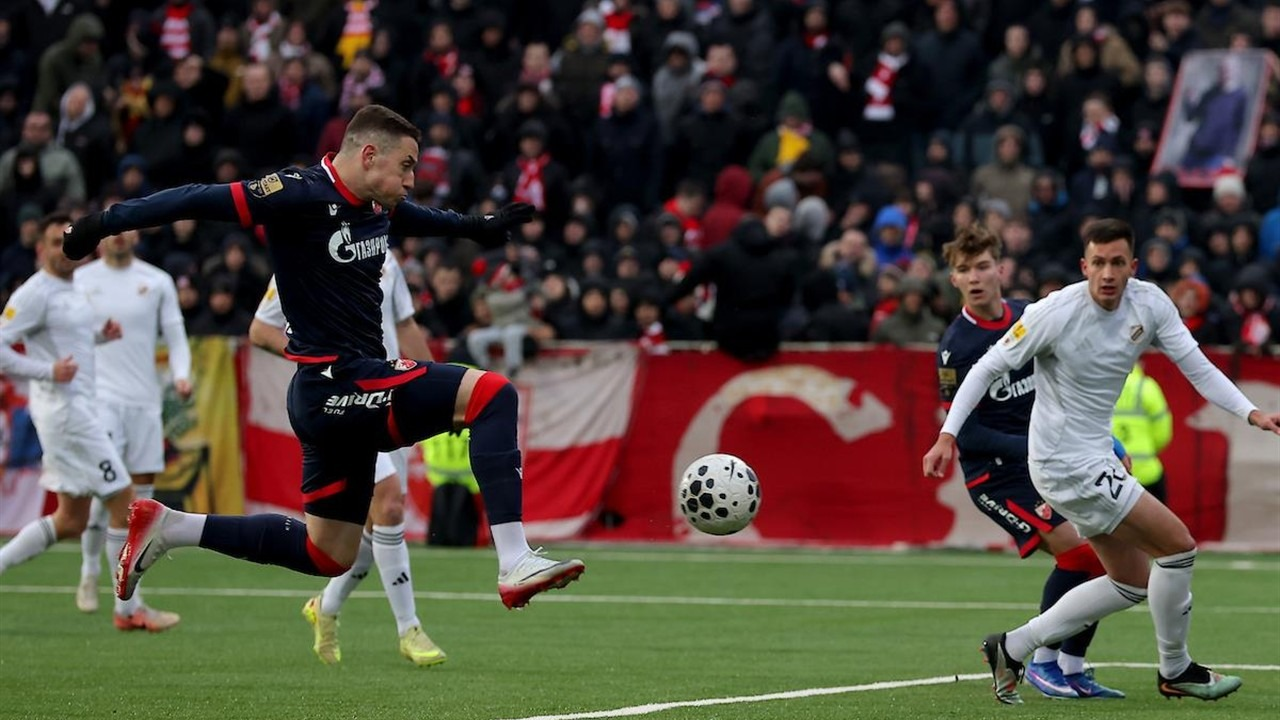 Red Star and Cukaricki players contest the ball