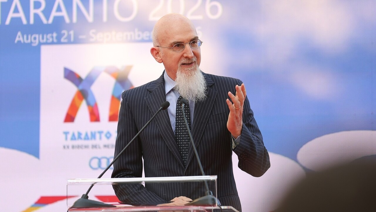 An official speaks at a Mediterranean Games event