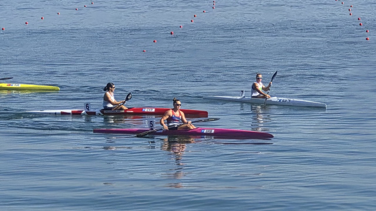Kayak athletes race between marked lanes