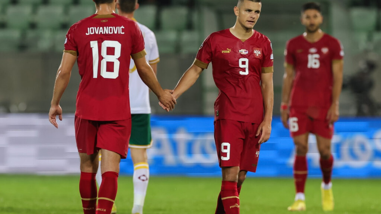 Luka Jovic walks with a teammate after an international match