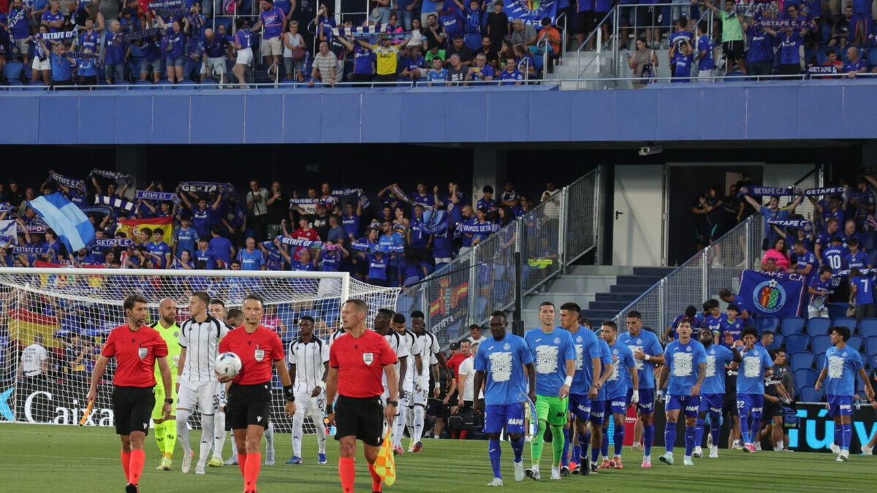 Mladost Lucani and Partizan walk onto the field