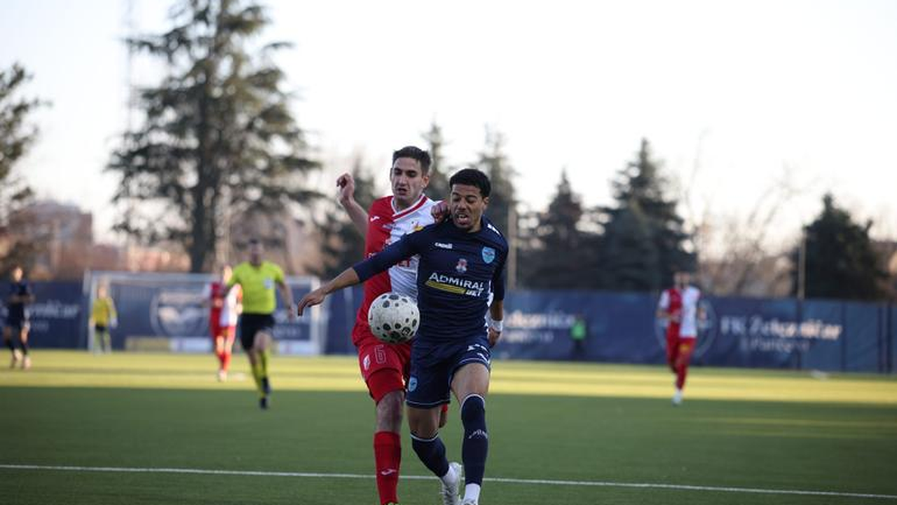 A Vojvodina player challenges a Zeleznicar opponent
