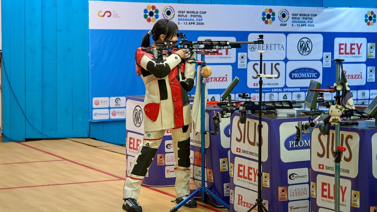 A female athlete competes in the ten-metre air-rifle event