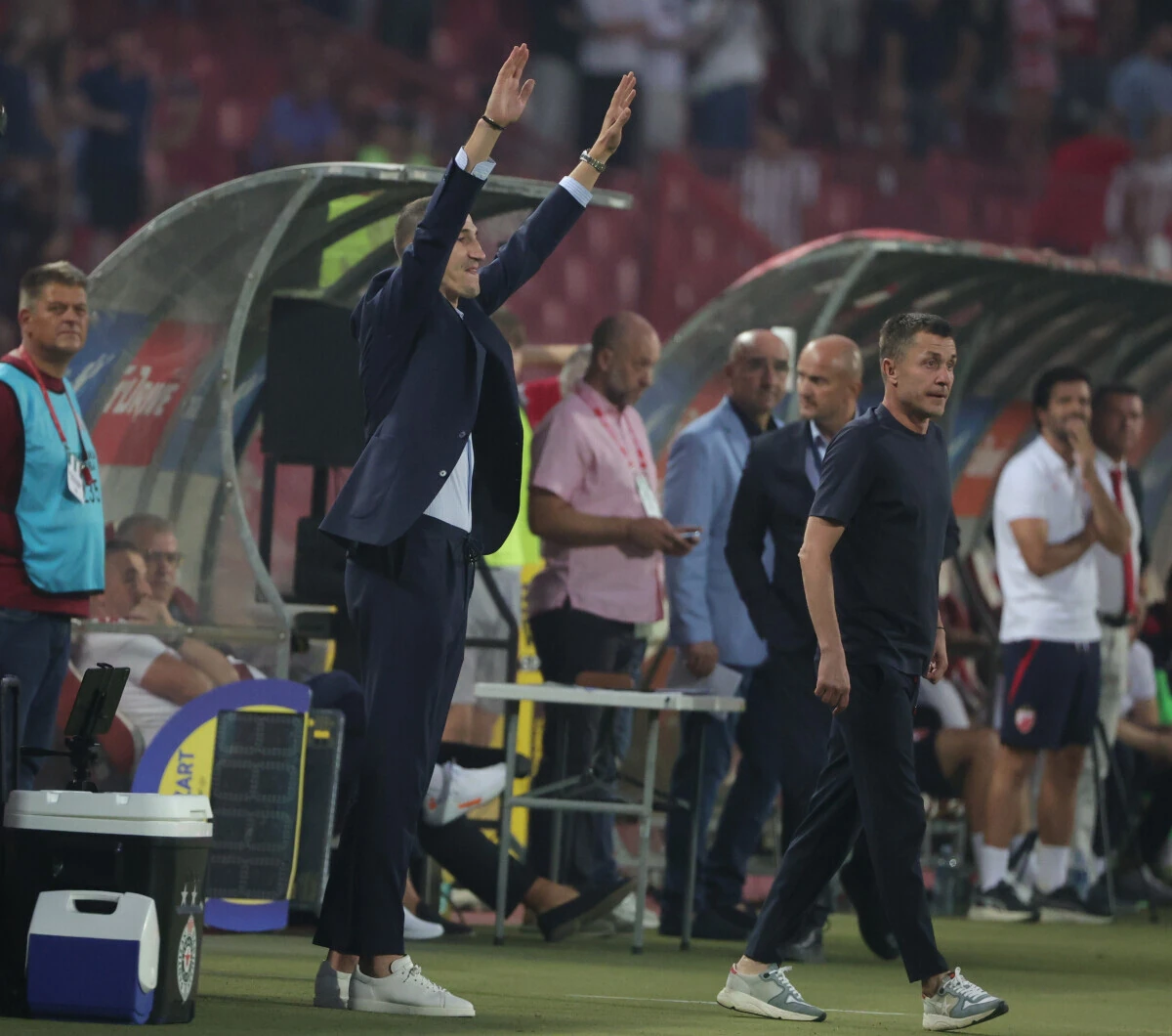 The coaches beside the pitch during the September 6 derby, before Zvezda's visit to IMT.