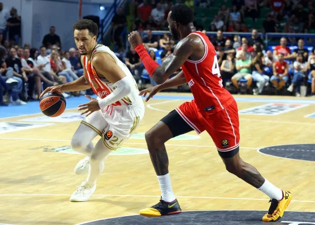 A Crvena Zvezda ball handler faces an Olympiacos defender in Nicosia.